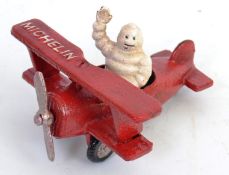 MICHELIN MAN: A small reproduction 20th century metal advertising figure of Bibendum the Michelin