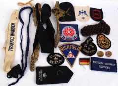 A large collection of assorted military / civilian uniform patches / embroidered bands etc.