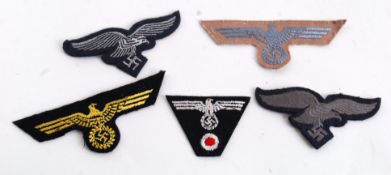 A selection of Third Reich Cloth Insignia to include ,