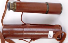 TELESCOPE: A vintage post-WWII leather bound four draw brass telescope. Within the original case.