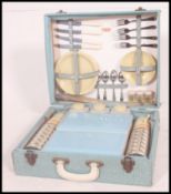 A 1960's baby blue cased four persons  P