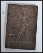 A silvered bronzed medallion concerned w