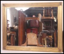 A large 20th century contemporary gilt overmantel wall mirror.
