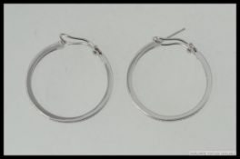 A pair of white metal 925 silver and cz