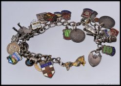 A silver white metal charm bracelet, ado