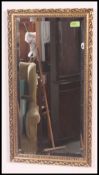 A gilt framed 20th century wall mirror,