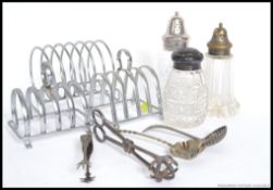 A collection of silver plated toast rack