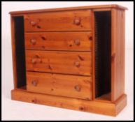 A contemporary pine cd cabinet - side ha