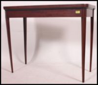 A Georgian mahogany inlaid card table /