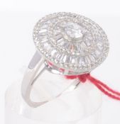 A silver ladies cocktail ring with round