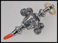 A Victorian style babies rattle, stamped