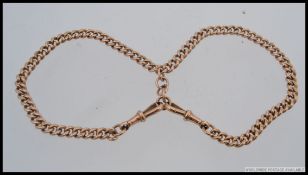 An early 20th century 9ct gold twin chai