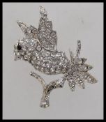 A vintage pave set diamonte bird brooch