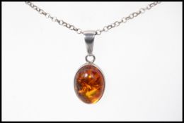 A 925 silver pendant necklace with amber
