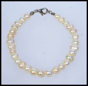 A white metal baroque pearl bracelet. Me