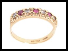 A vintage 9ct gold ring set with four 3p