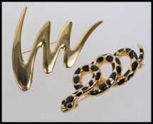 Two large vintage yellow metal brooches