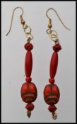 A vintage pair of red coral scarab beetl
