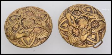 A vintage yellow metal cloak clip clasp