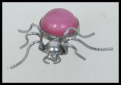 Vintage white metal spider brooch with l