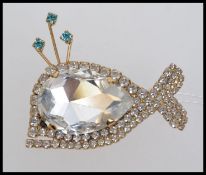 A large vintage whale brooch set with a