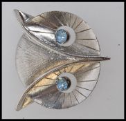 A large Art Deco style white metal owl b