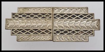 A 1930s Art Deco German white metal cloa