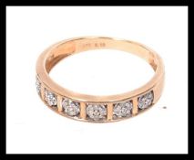 A 9ct gold and diamond half eternity rin