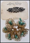 A vintage wirework brooch together with
