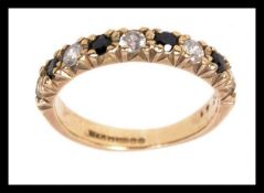 A 9ct gold half eternity ring set with C