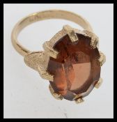 A vintage 1970s ring set with a large am