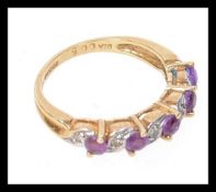 A 9ct gold half eternity ring set with a