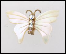 A vintage mother of pearl butterfly broo