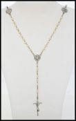 A vintage rosary with simulated pearls a