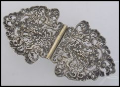 A large Victorian white metal belt buckl