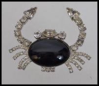 A large vintage crab brooch with central