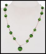 A 1930s Czech glass and rolled gold neck