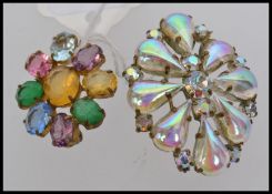 A vintage brooch with iridescent teardro