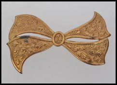 A 1920s vintage gold tone brooch in the