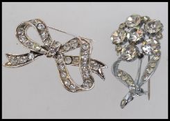 two vintage white metal brooches  one of