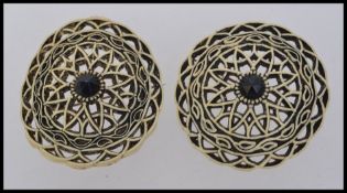 Two 1930s circular celluloid faux ivory