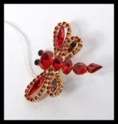 A Vintage yellow metal dragonfly brooch
