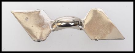 A 1930s art deco white metal cloak cape