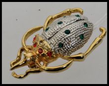 A large vintage scarab beetle brooch set