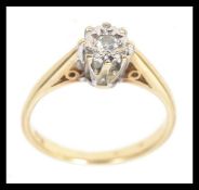 A 9ct gold diamond solitaire ring set wi