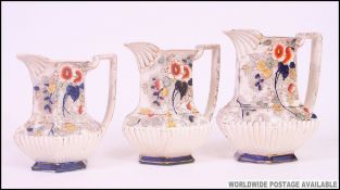 A collection of ceramic jugs to include Victorian graduating Imari pattern jugs x 3 along with 6
