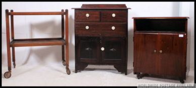 A 1930's Art Deco cabinet together with a trolley and 1950's vintage cabinet raised on castors.
