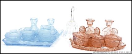 1930's Art Deco cut glass dressing table sets comprising tray, candlesticks etc.