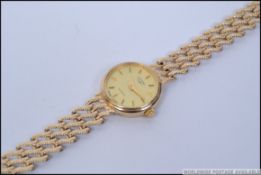 A good quality ladies 9ct gold Rotary dress watch set on wave link 9ct gold mesh link bracelet.