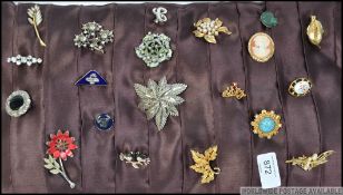 A pad of vintage and later costume jewellery brooches to include enamel examples